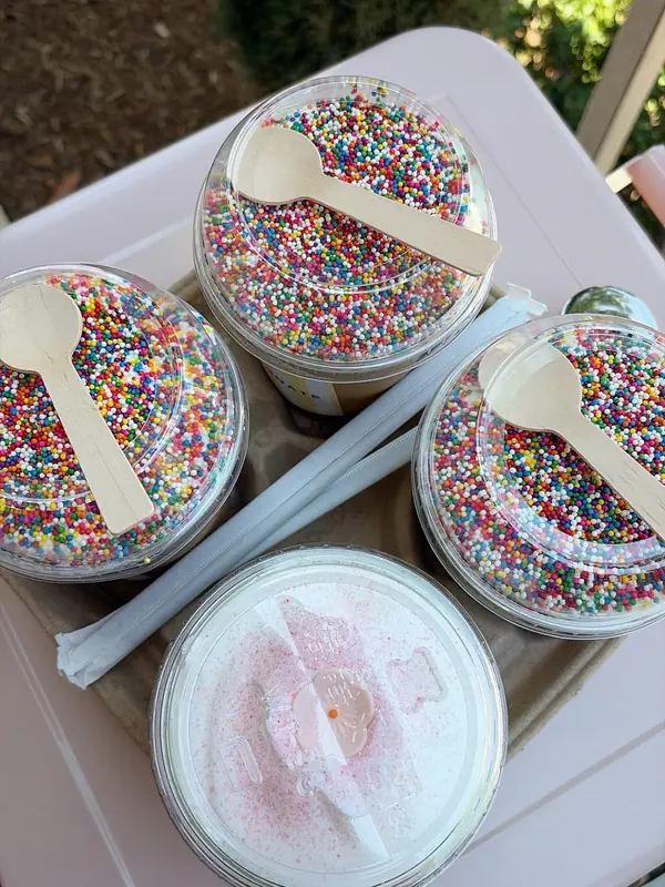 Birthday dot cake drinks covered in rainbow dot sprinkles